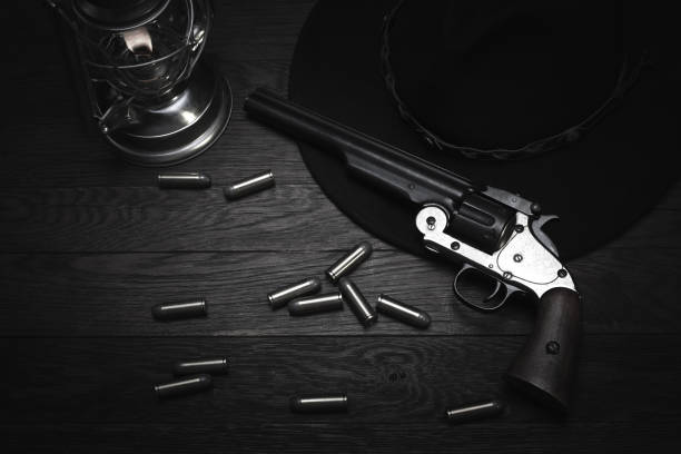 istock Old western cold blast lantern and revolver with cartridges 1223708033