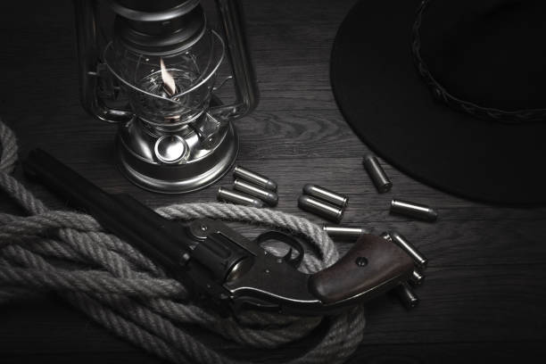 istock Old western cold blast lantern and revolver with cartridges 1223708059