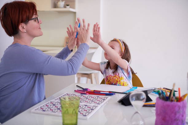 istock Mother and little daughter  playing together  drawing creative artwork 1223709371