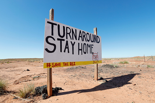 Signs along the road from Leupp to I-40 encourage people on the Navajo Nation to stay at home. COVID-19 hit the nation's rural people particularly hard. Taken May 5, 2020.