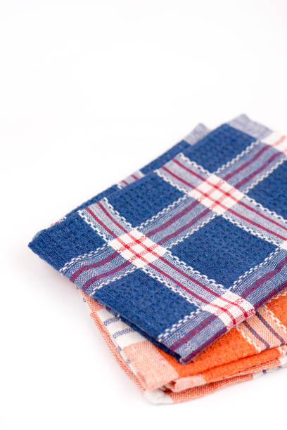 istock Blue and orange new kitchen dishtowels over white background 1223722256