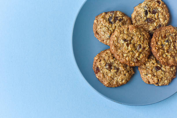 oatmeal raisin cookie with crumbs white background