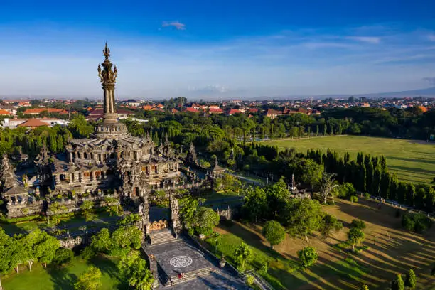 Aerial view taken by drone of the Bajra Sandhi famous monument in Renon area and surrounded with trees and gardens in central Denpasar in Bali.