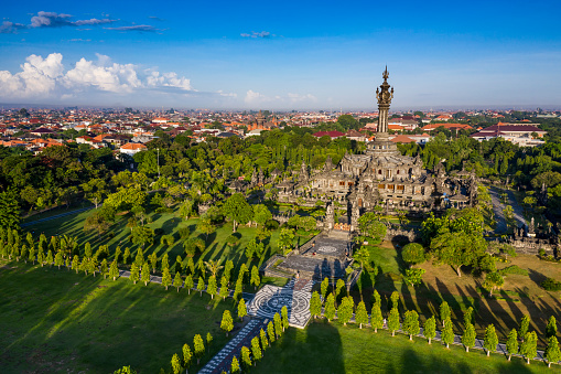 Aerial view taken by drone of the Bajra Sandhi famous monument in Renon area and surrounded with trees and gardens in central Denpasar in Bali.