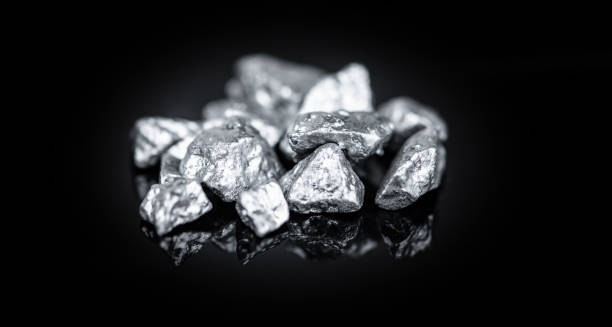 istock Heap of silver nuggets isolated on black background 1223725529