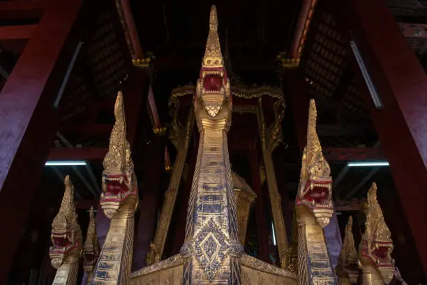 Photo of The ceremonial barge with 7-headed naga keeping in Wat Xieng Thong of Luang Prabang, Laos.