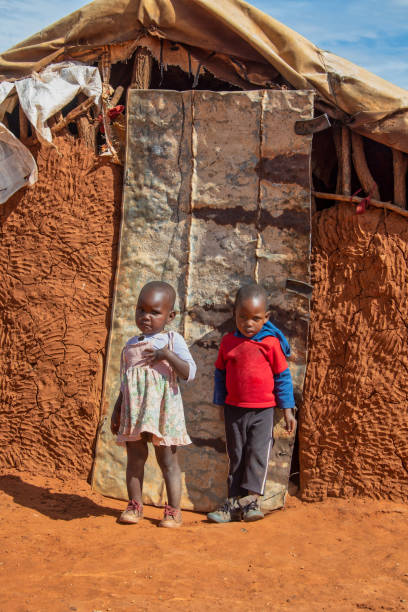 African children in front of the house African children in front of the house in a village in Botswana bushmen stock pictures, royalty-free photos & images