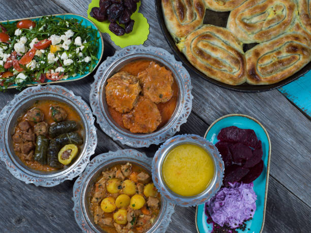 istock Eid Mubarak Traditional Ramadan Iftar dinner. Assorted tasty food in authentic rustic dishes on wooden table background. 1223732248