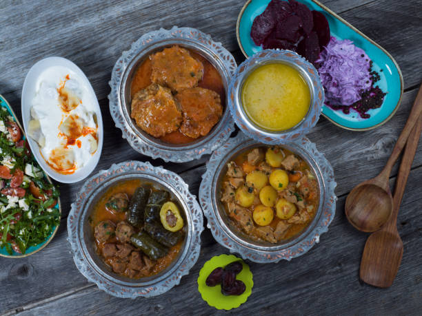 istock Eid Mubarak Traditional Ramadan Iftar dinner. Assorted tasty food in authentic rustic dishes on wooden table background. 1223732288