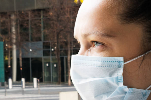 istock Woman Outside Wearing Face Mask 1223736592