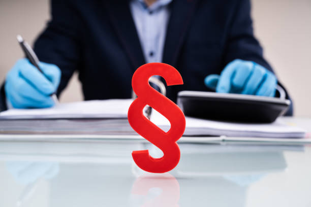 Paragraph Sign At Lawyer Desk Writing Report In Gloves