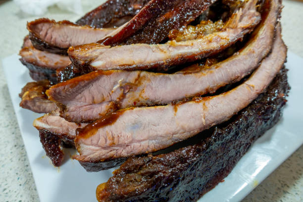 istock Beef ribs roasted to tenderness and cut into pieces for serving on a plate 1223738161