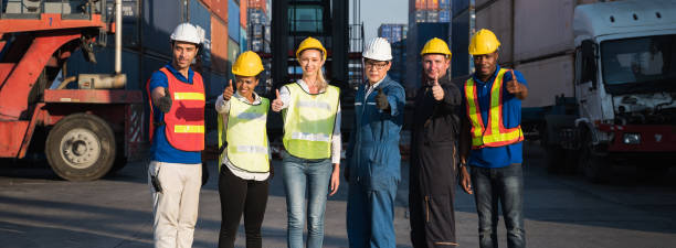 istock Group of foreman man & woman worker working checking at Container cargo harbor to loading containers. Dock male and female staff business Logistics import export shipping concept. 1223738989