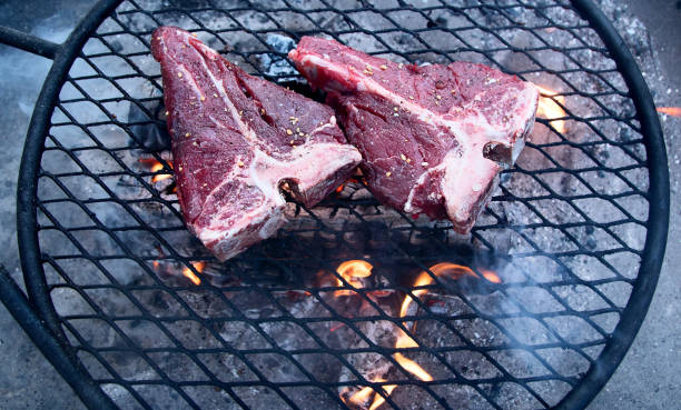 istock Grilling  beef steaks on flaming grill 1223739030