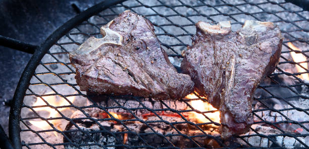 istock Grilling  beef steaks on flaming grill 1223739761