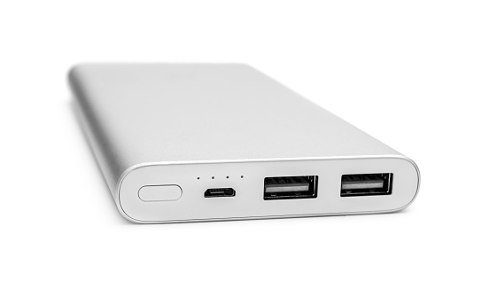 Powerbank for charging mobile devices on white.