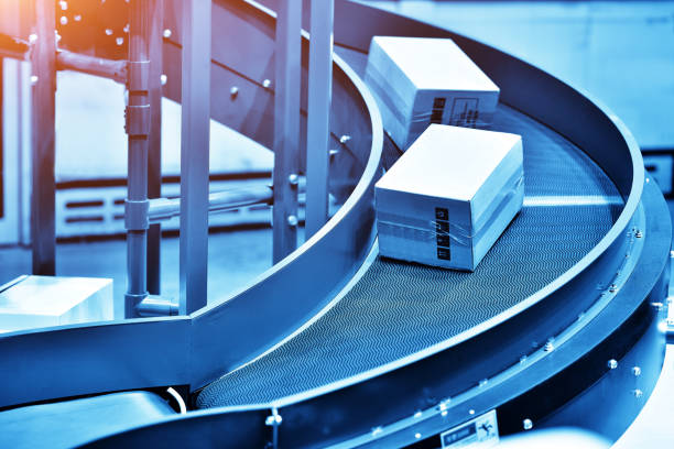 istock Cardboard Boxes on Conveyor Belt at Logistics Warehouse 1223742475