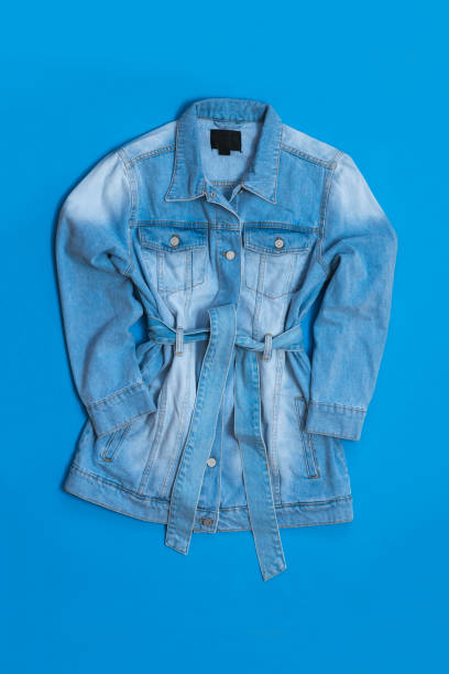 istock Denim coat for women on a bright blue background. 1223743398