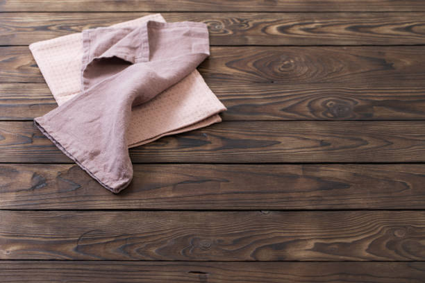 istock linen napkin on dark wooden table 1223744488