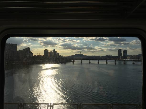 While passing bridge by subway train, water glows on a sunny day. Scene of Hangang (Han river), a main and huge river of Seoul, South Korea.
