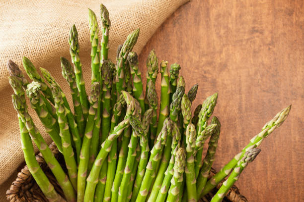 istock Fresh organic Asparagus close up on wooden, rustic background 1223747910