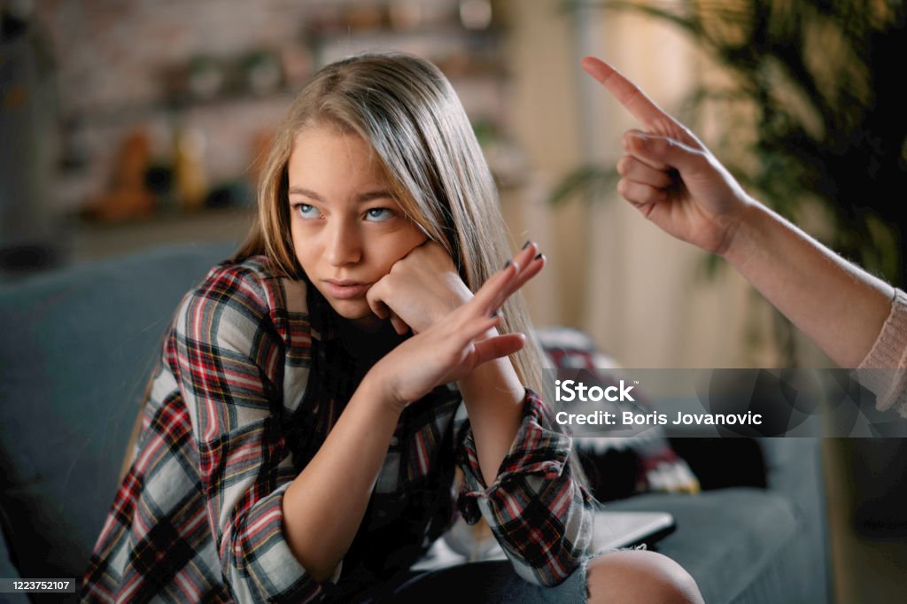 Mother scolding daughter. Mother scolding daughter. Girl afraid of her mother. Teenager Stock Photo