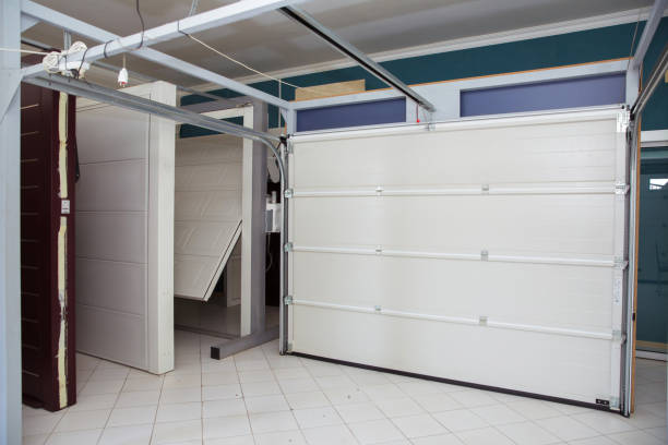 istock Shutter door or roller door and concrete floor outside .White Automatic shutters in a house . gates in the garage . Automatic Electric Roll-up Gate Or Push-up Door In The Modern Building Ground Floor . 1223759248