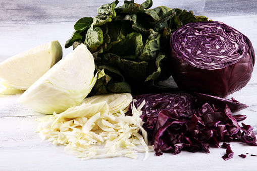 Three fresh organic cabbage heads. Antioxidant balanced diet eating with red cabbage, white cabbage and fresh savoy