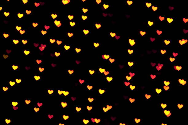 istock Golden colored heart bokeh festive glitter background 1223762736