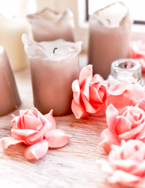 istock CANDLES AND ROSES ON THE TABLE IN PASTEL FLOWERS 1223764897