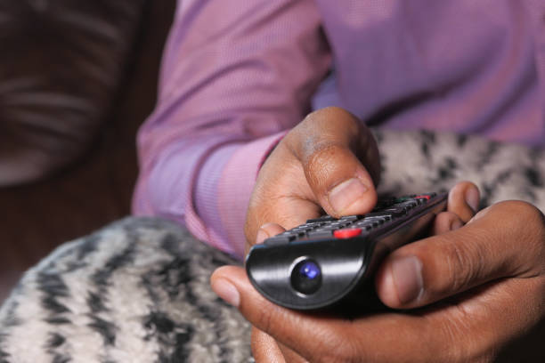 istock close up of a person using tv remote 1223767273