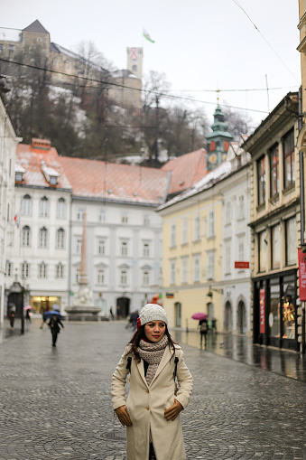 asian traveler walking on the old town area in Ljubljana city