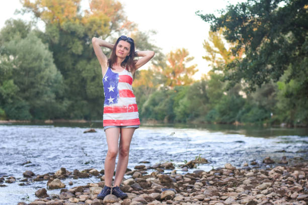 istock Beautiful middle aged woman on river coast 1223772738