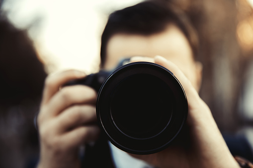 Close up view of a man taking photo of himself