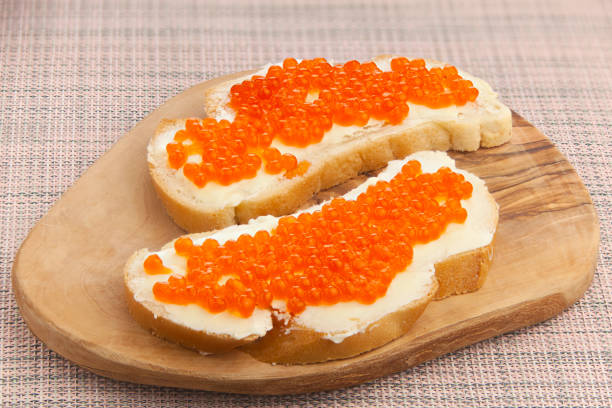 istock delicious appetizing sandwich with red caviar on  wooden 1223776115
