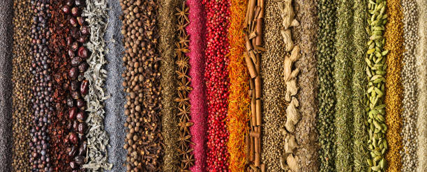 istock Spices scattered on the table, background for design. Colorful condiments as decoration of packing with food. 1223779650