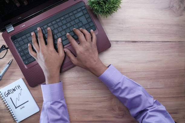 istock person hand typing on laptop on office desk 1223781028