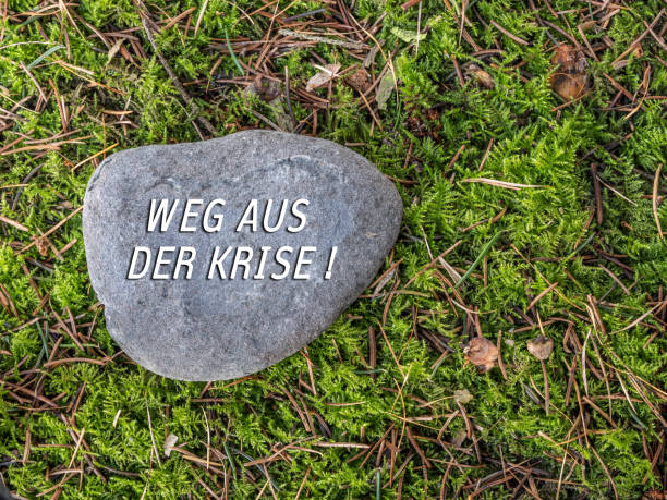 istock Stone with writing Way out of the crisis 1223783444