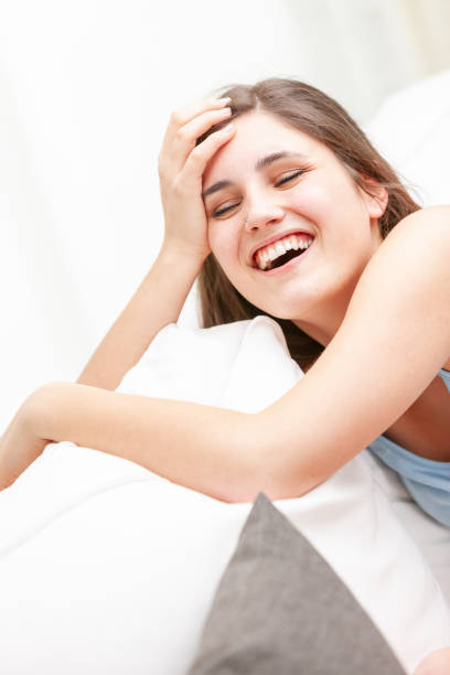 istock Happy vivacious young woman laughing 1223783630