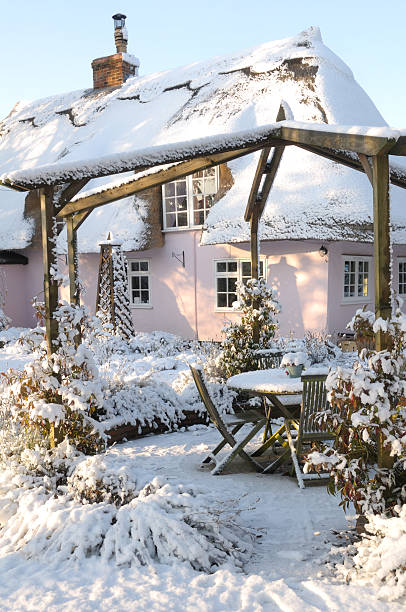 Snowy cottage.  essex england stock pictures, royalty-free photos & images