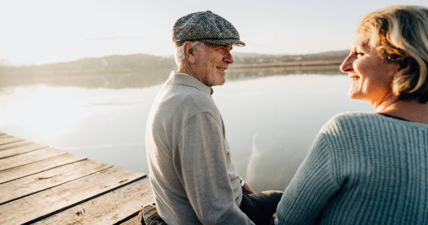 istock Senior couple on a lake dock 1223789483
