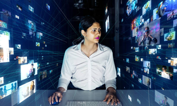 istock Latina woman watching hologram screens. GUI (Graphical user interface). 1223790015