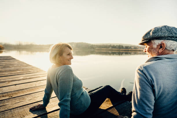 istock Senior couple on a lake dock 1223790021