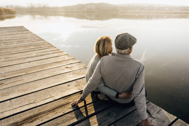 istock Senior couple on a lake dock 1223790023