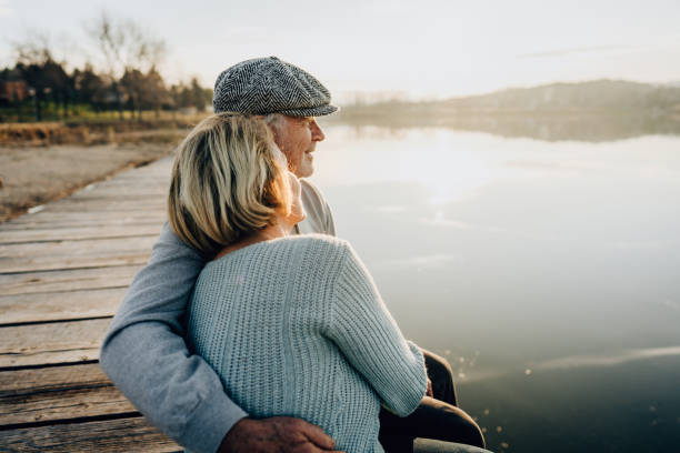 istock Senior couple on a lake dock 1223790054