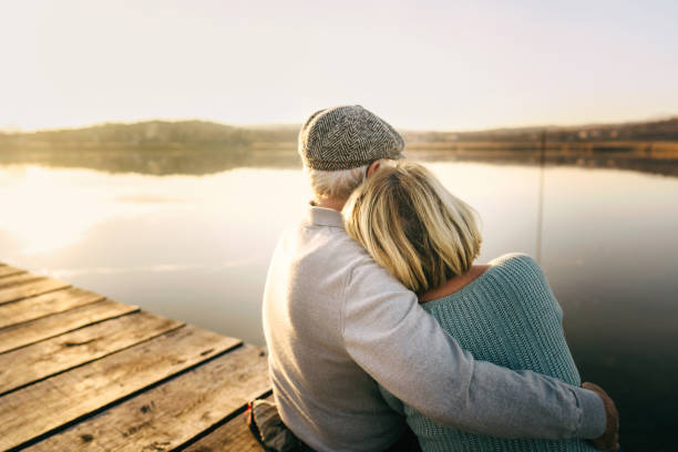 istock Senior couple on a lake dock 1223790210