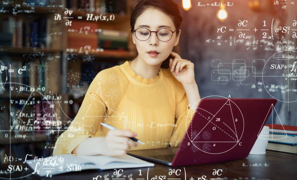 Young asian woman studying in the room. Education concept. Science technology. Mathematics. Young asian woman studying in the room. Education concept. Science technology. Mathematics. mathematical symbol stock pictures, royalty-free photos & images