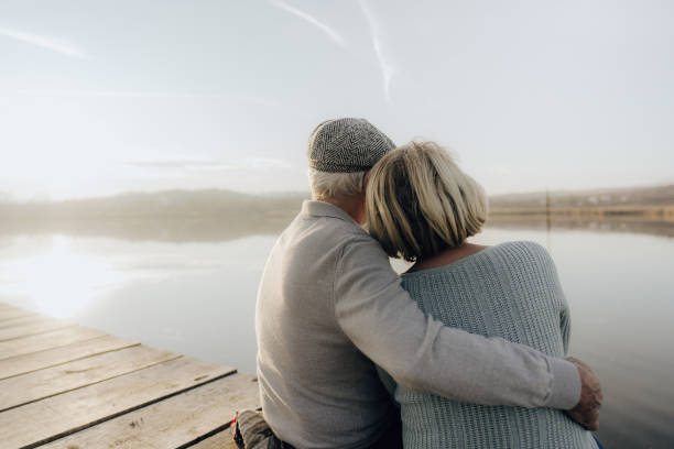 istock Senior couple on a lake dock 1223790643