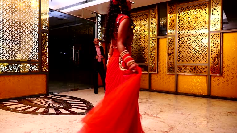 Slow motion of dancing Indian Bride in front of her husband in reception party hall