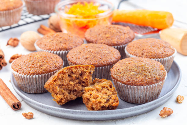 istock Homemade carrot cake muffins with walnuts on a gray plate, horizontal 1223791751